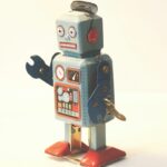 gray and orange plastic robot toy