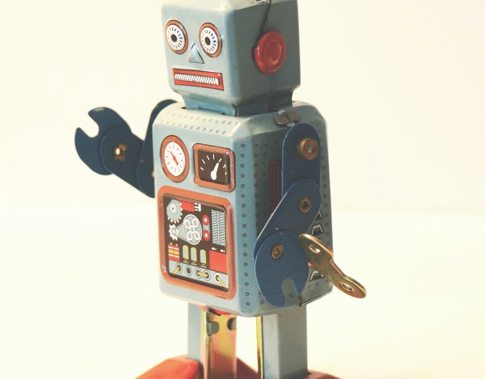 gray and orange plastic robot toy