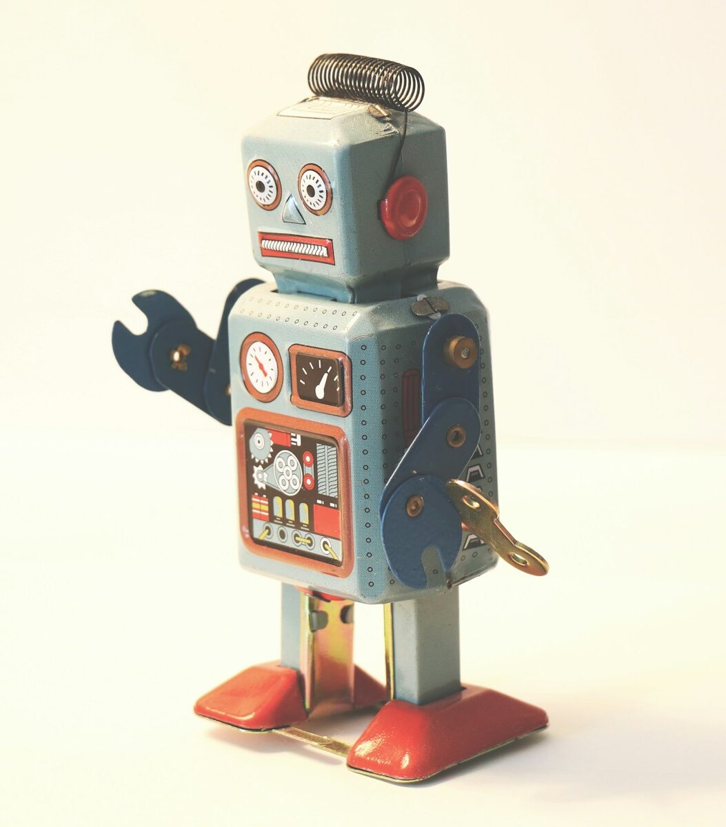 gray and orange plastic robot toy